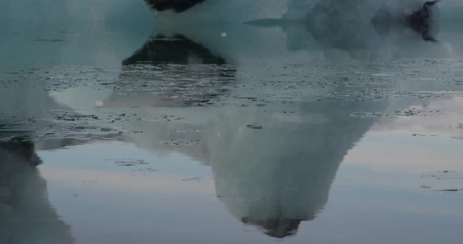 The water below is reflecting ice hills