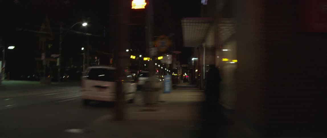 Moving fast past some streets at night