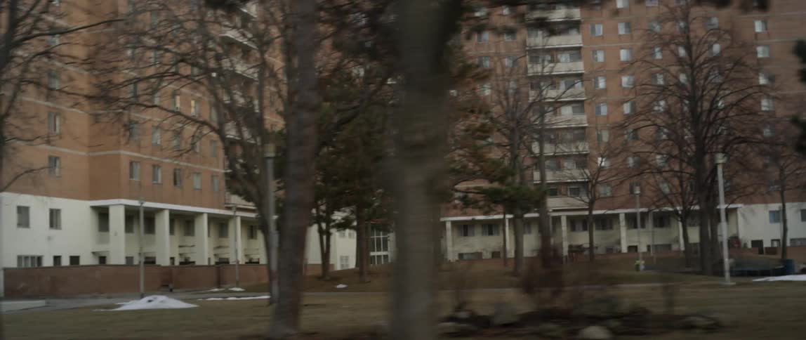 Moving past rows of buildings
