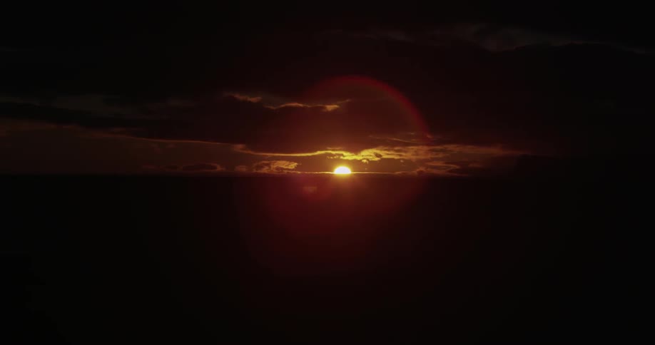 Time lapse of a sun setting in the distance