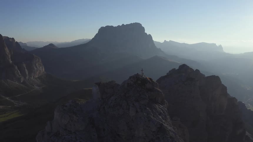 Mountains with peaks high in a hazy sky