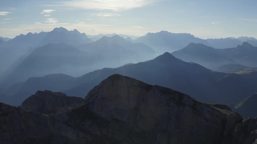 Aerial view of fog and mist over the mountains in the morning