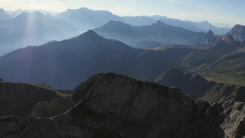 Aerial view of fog and mist over the mountains in a mountain range at morning