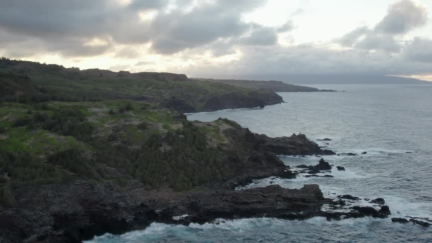 An aerial view of waves rolling in to the shore