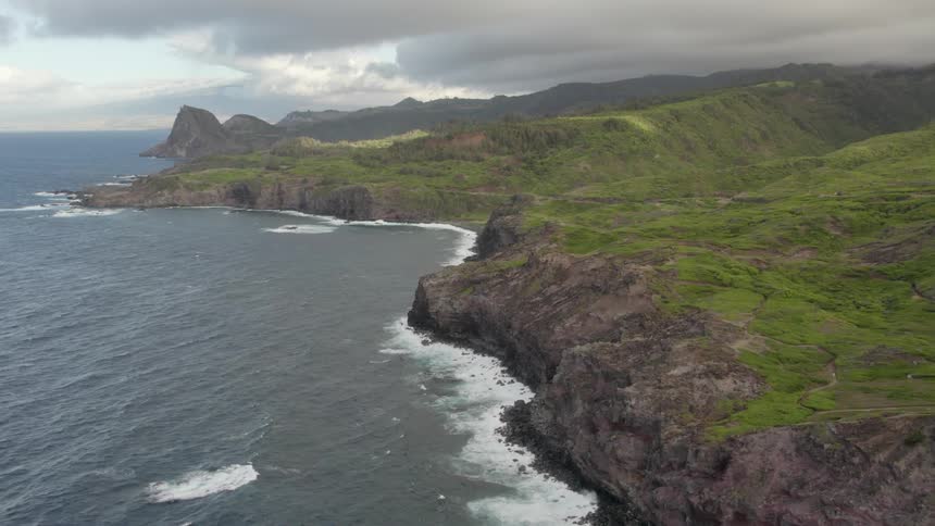 An aerial view of waves rolling in to the shore