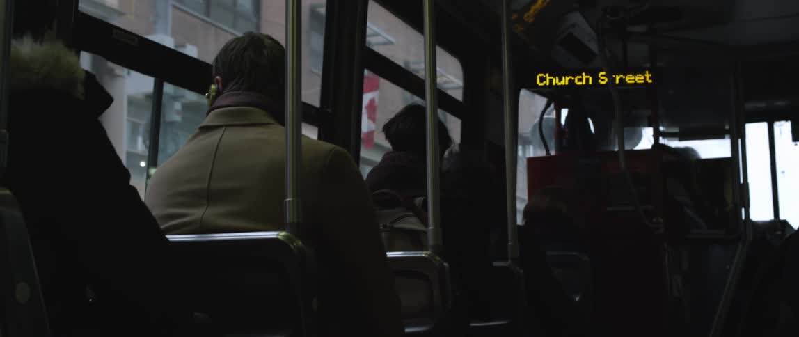 People are riding a bus with a sign flashing church street