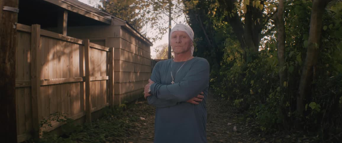 A portrait of a man standing outdoors