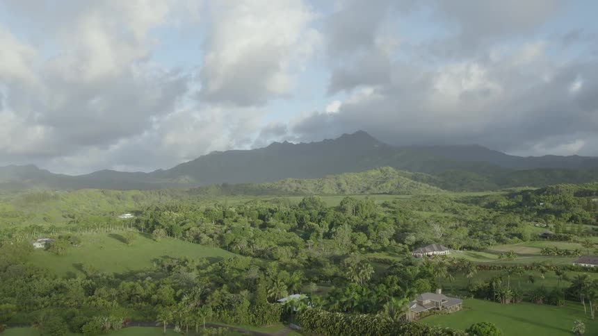 An aerial view of large homes spread out in a rural area