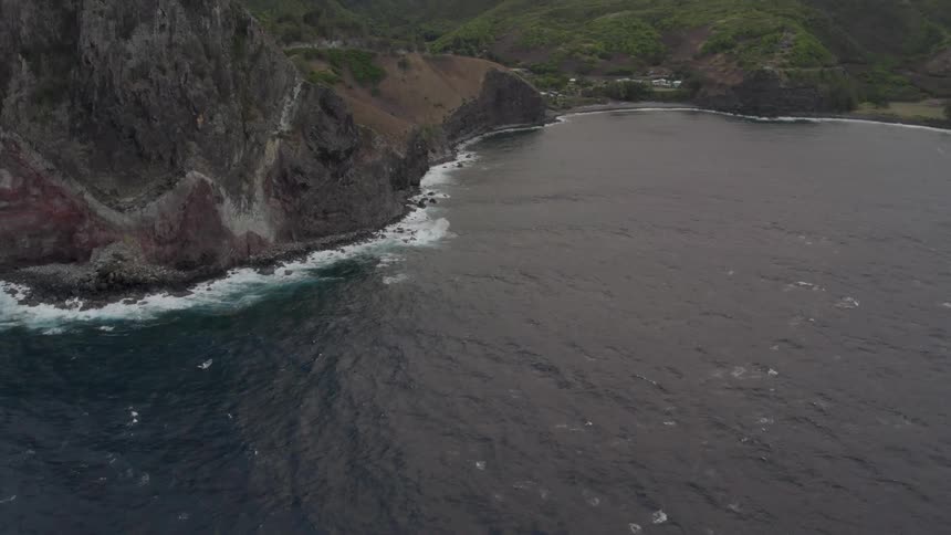 An aerial view of a coast with cliffs