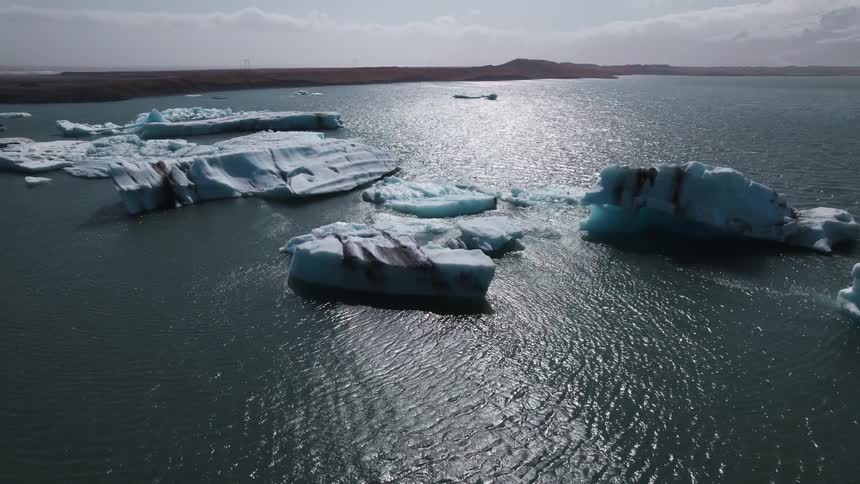 The water near the island is full of icebergs