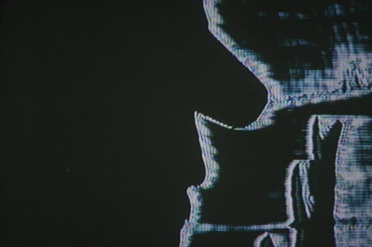 The negative image of a hand is moving around