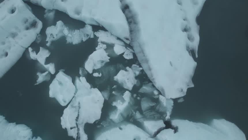 The water is filled with icebergs