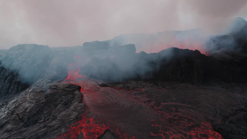 The volcano is erupting with waves of lava and smoke