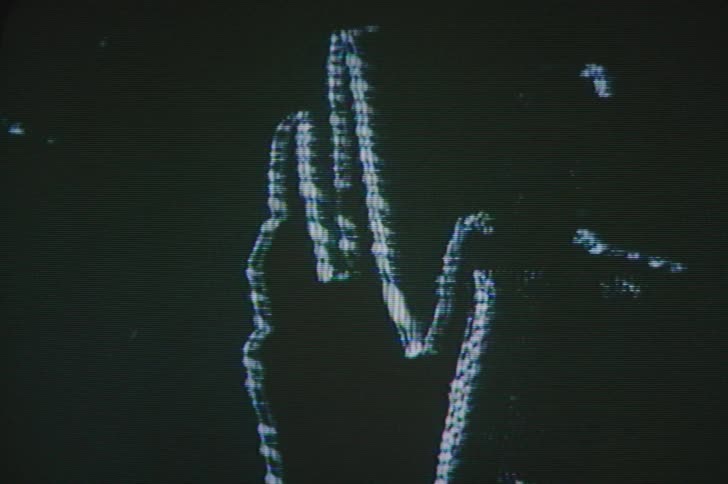 A view of white hands rotating on a screen