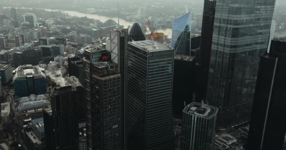 Buildings and skyscrapers in a big city on a foggy day