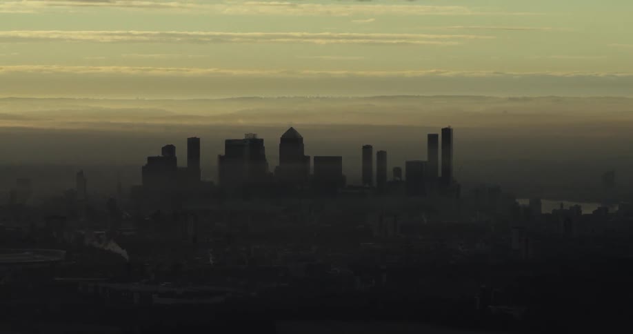 Fog shrouds city skyline and nearby river