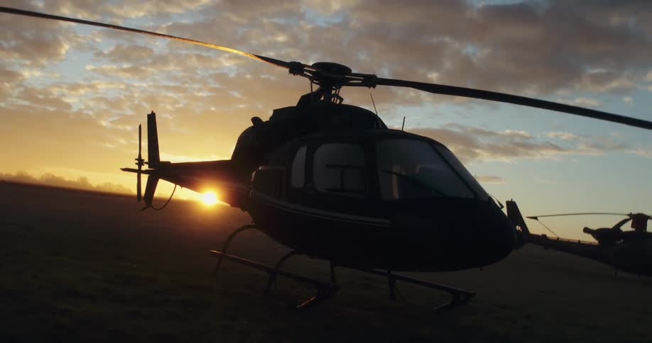 A view of a helicopter sitting on a runway
