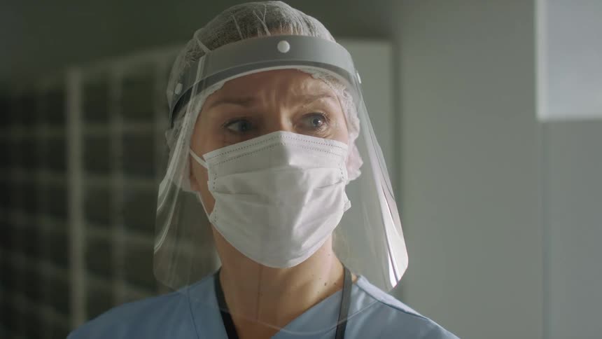 A view of a woman doctor in a room