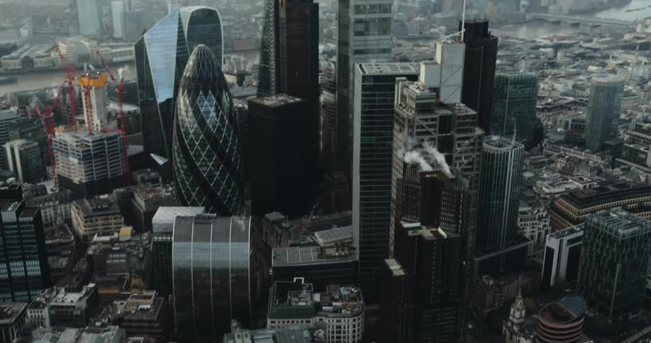 Aerial view of a big city with modern buildings and skyscrapers in a hazy sky