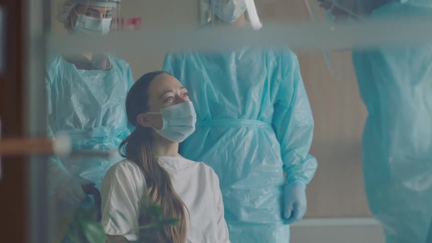 A patient talking to doctors in an office
