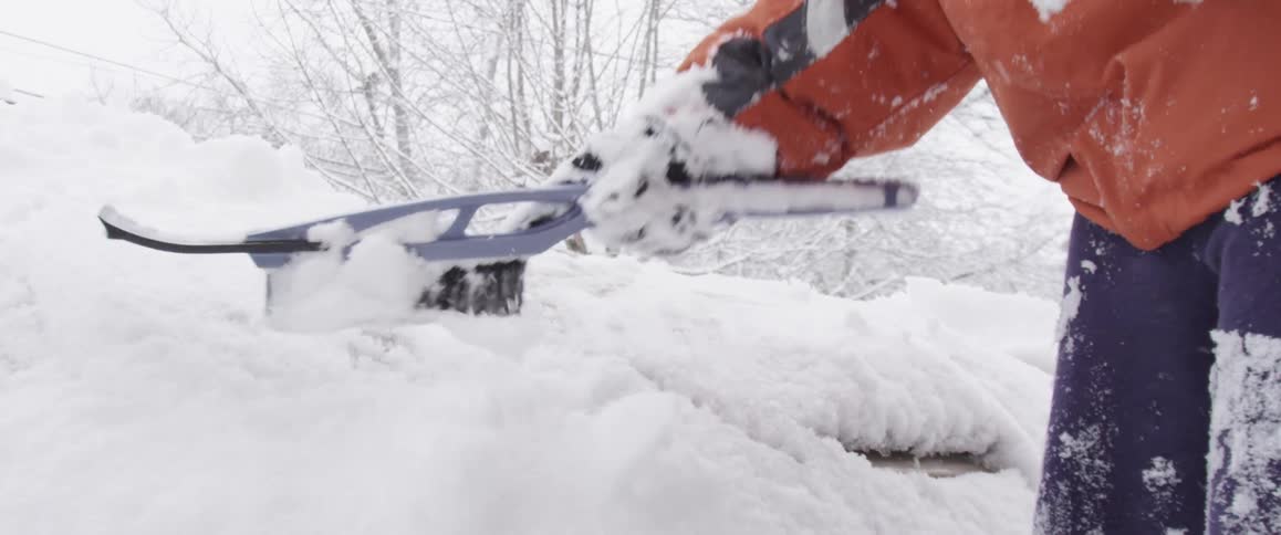 Snow being wiped from a car