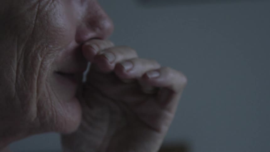 Close up of an elderly lady looking upset