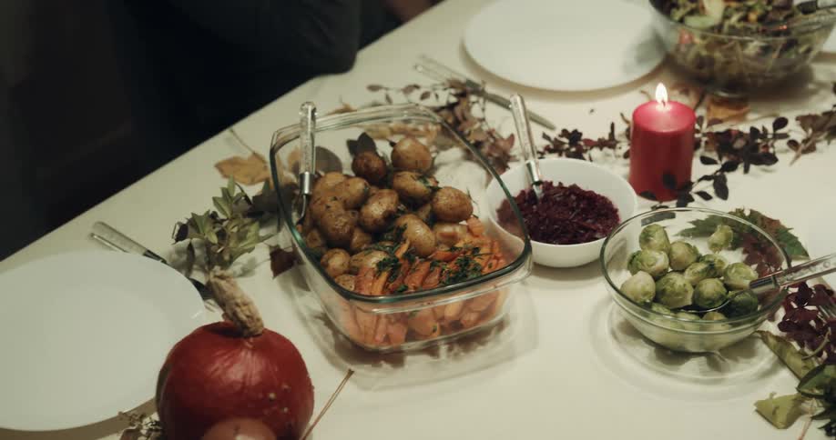 Person places side dish onto decorated table