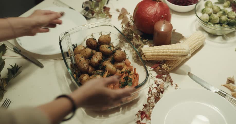 Female putting food on table