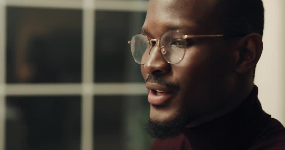 A close up of a man talking
