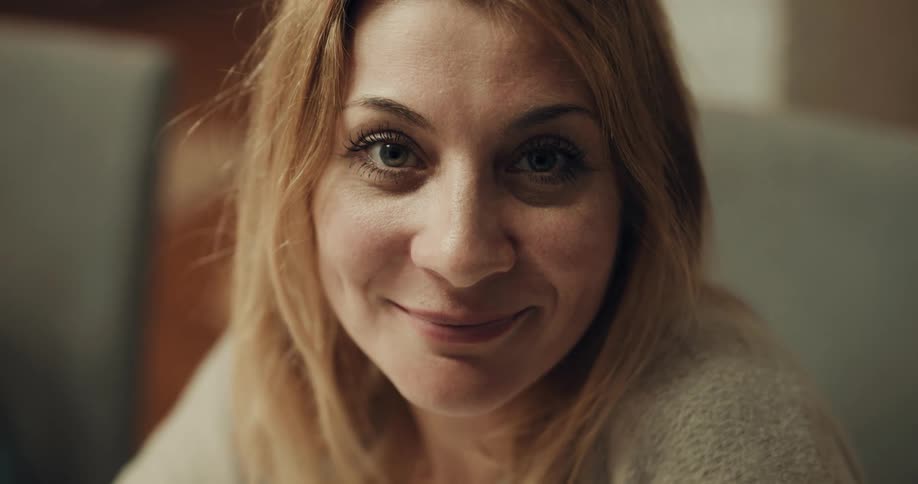 A woman is sitting and talking