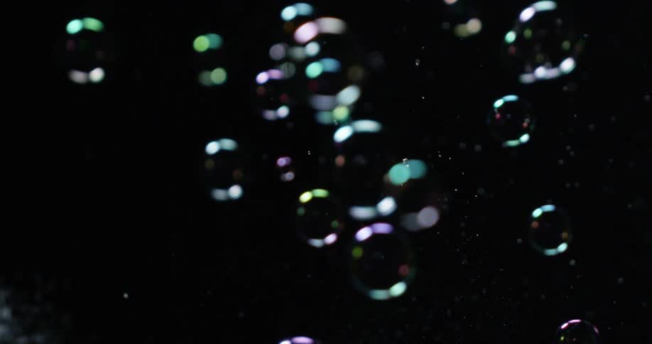 Small bubbles float around in a black area