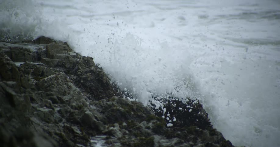 Waves crash against rocks on the shoreline