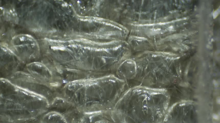 Extreme close up of the rugged metallic surface of a machine