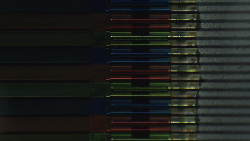 The microscopic image is of colored metal stacked up
