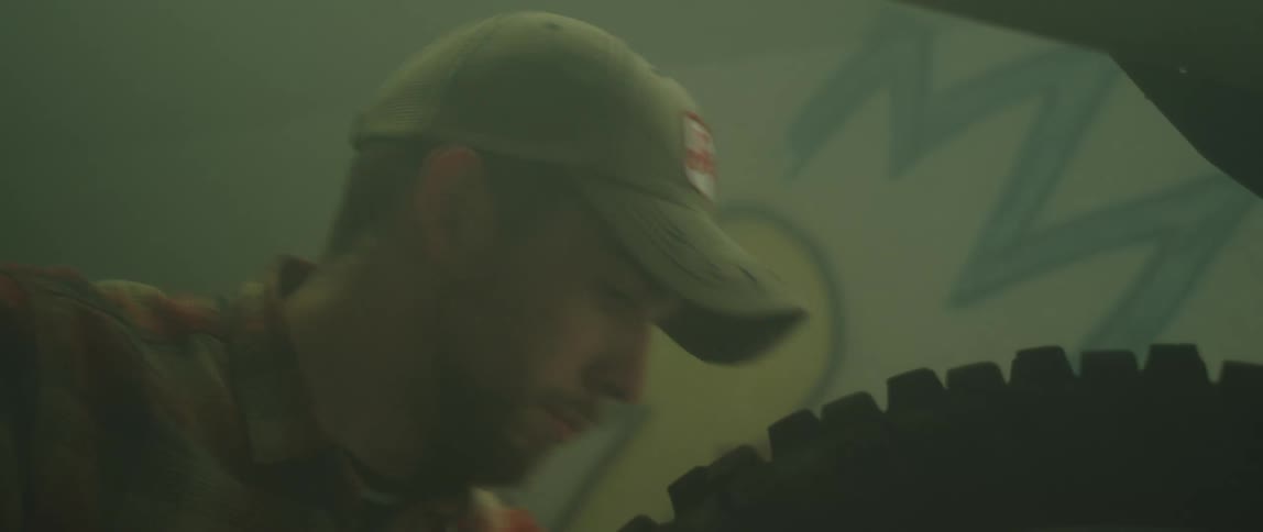 Person fixing motorcycle