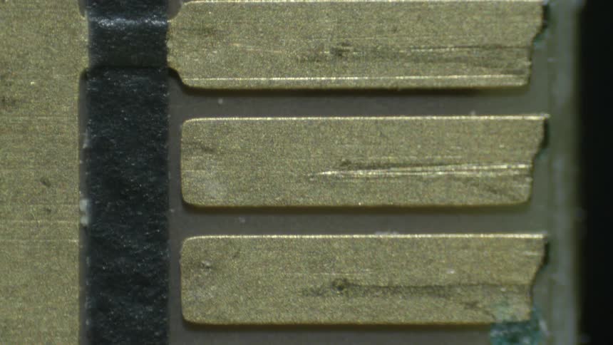 Gold rectangles sit against a silver base on a plaque