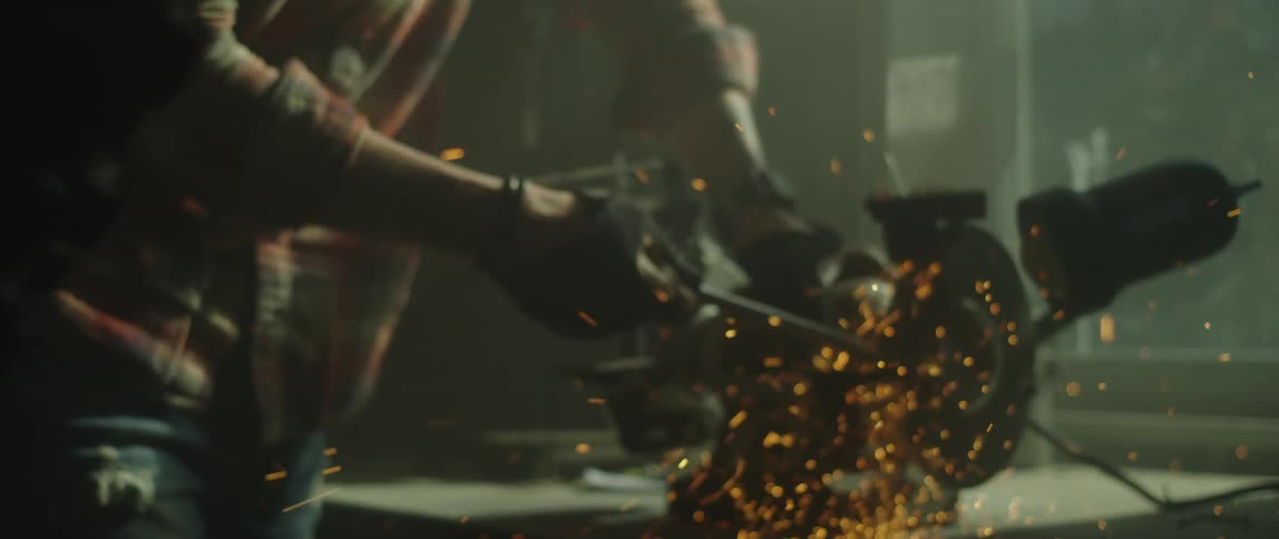 Sparks fly as a man is grinding metal