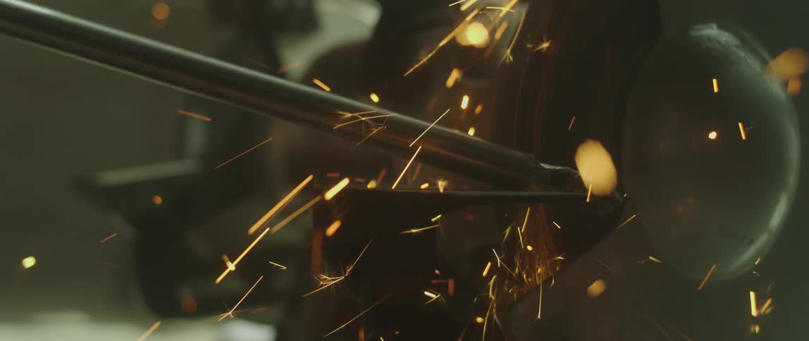 Sparks fly as a piece of metal gets grinded