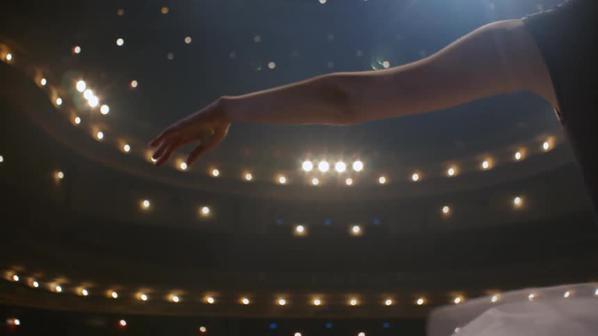 Young ballerina arm and hand rising up