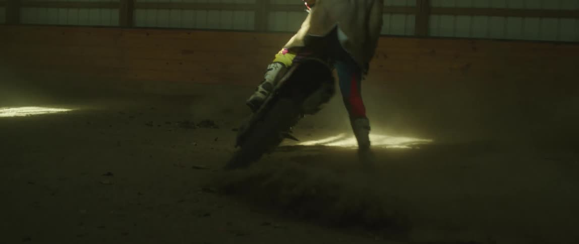 A person is spinning around on their dirt bike