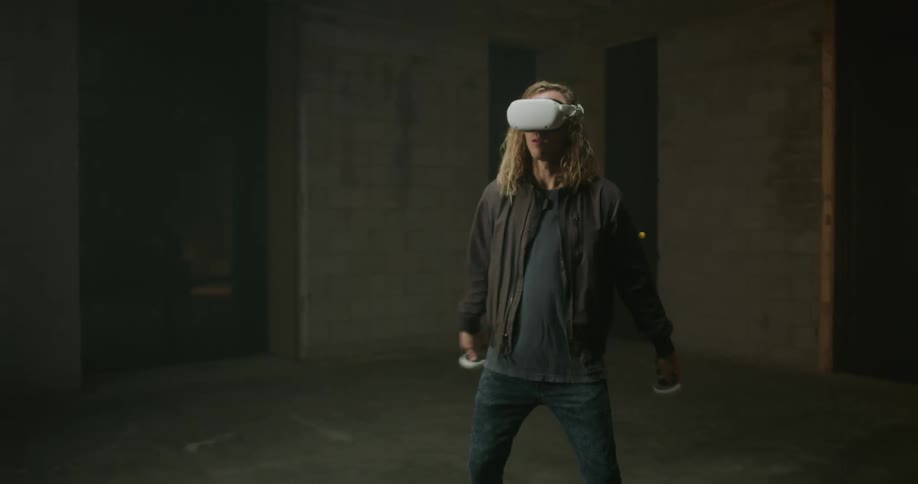 A man is playing with a virtual reality headset