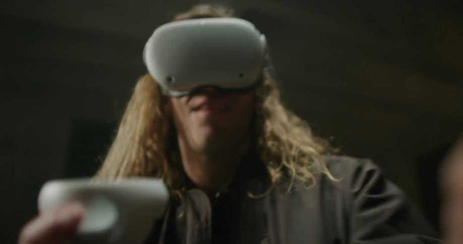 A man is moving around fast playing virtual reality