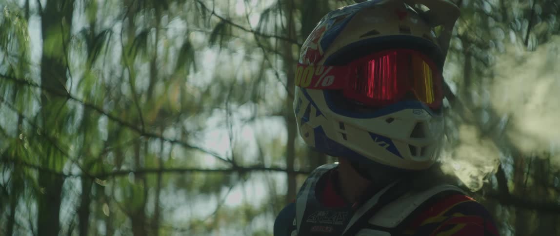 Smoke comes out of the dirt bikers helmet