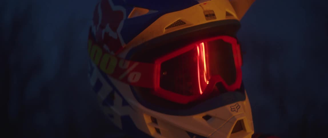 A person in a helmet looks around