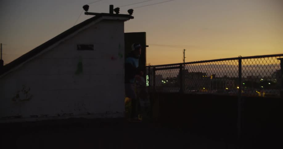 A man flees on the roof top