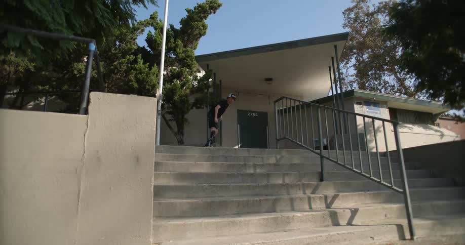Skateboarder with prosthetic leg takes jump over stairs