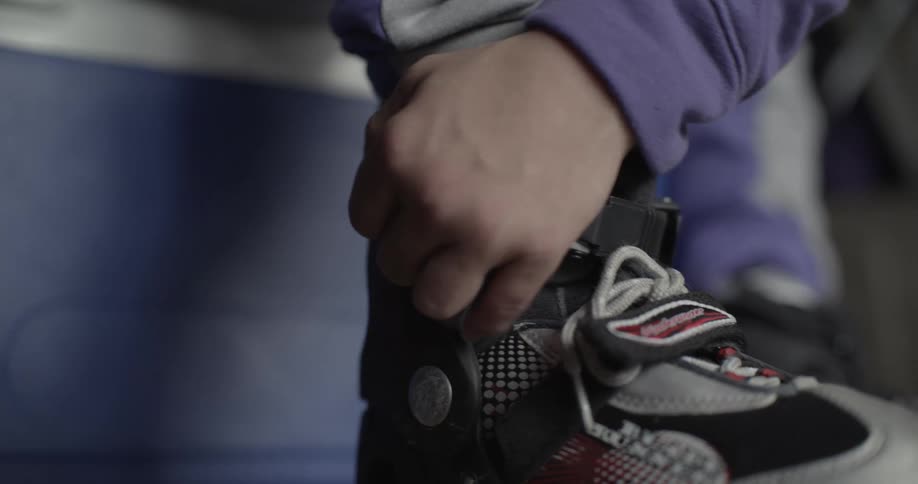 Person tightening rollerskate