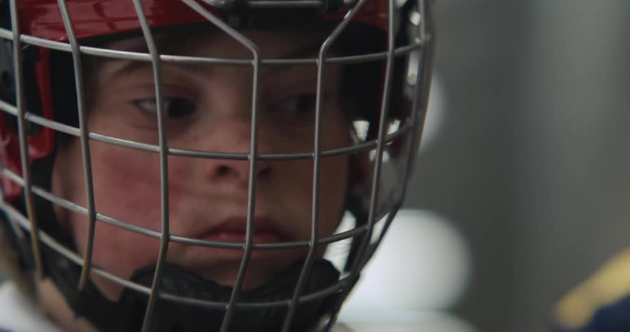 Female athlete wearing protective gear waits