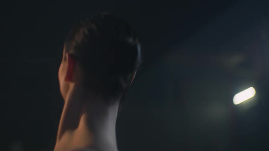 A ballerina smiles as she dances