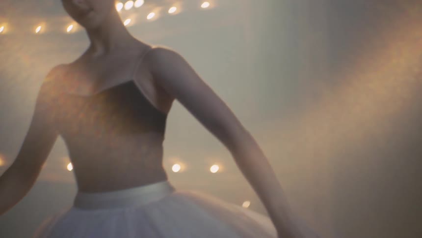 A ballet dancer practices on stage